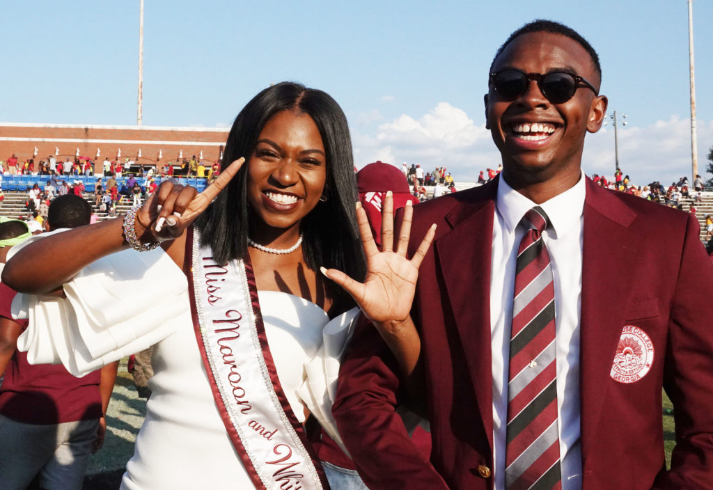 Miss Maroon and White Anta Njie and SGA President Quintin Paschall celebrate the Maroon Tigers becoming 6-0 after beating Tuskegee in triple overtime. By Philip McCollum