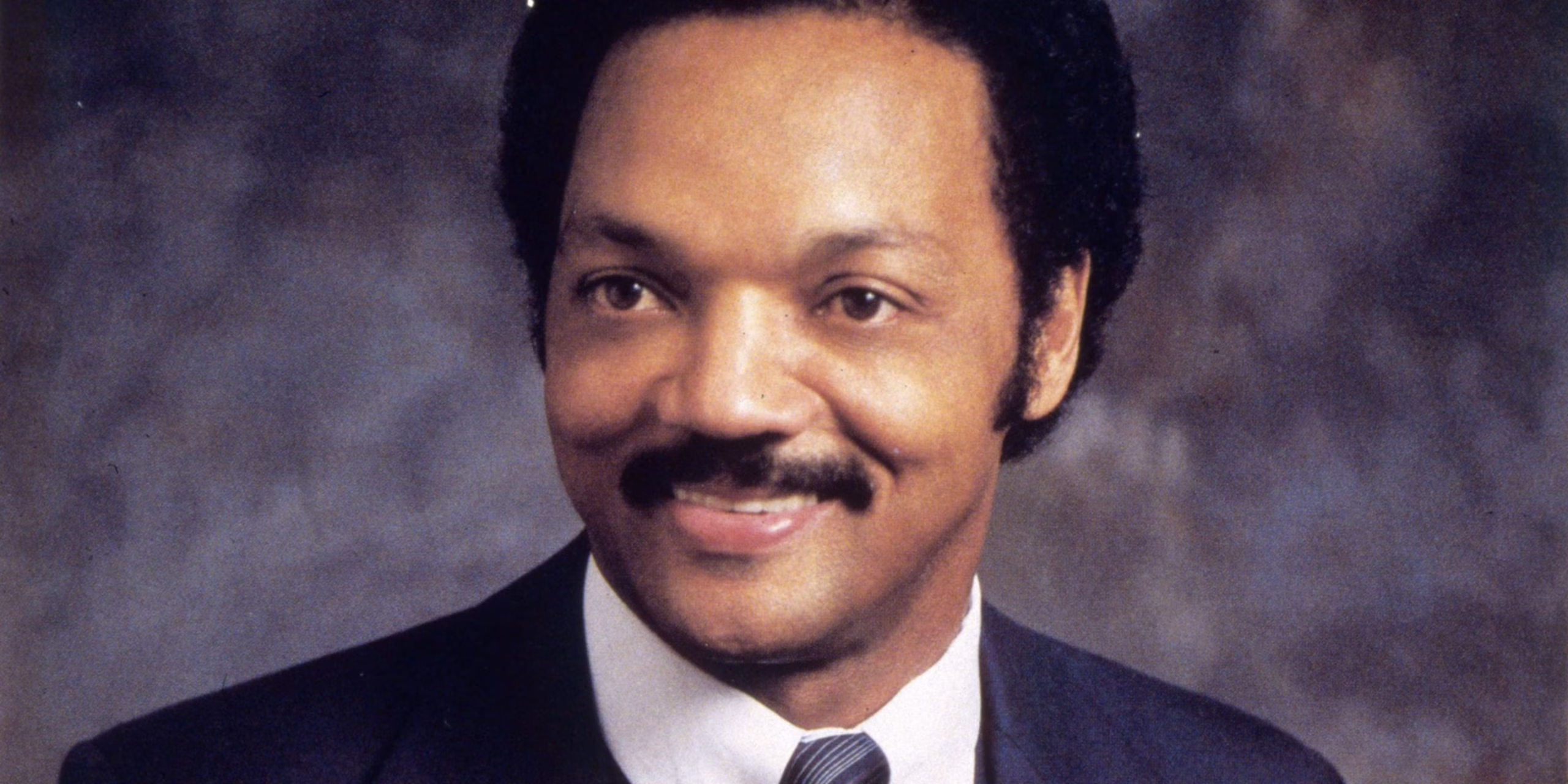 Jesse Jackson, civil rights leader and two-time presidential candidate, is pictured here in a professional headshot.